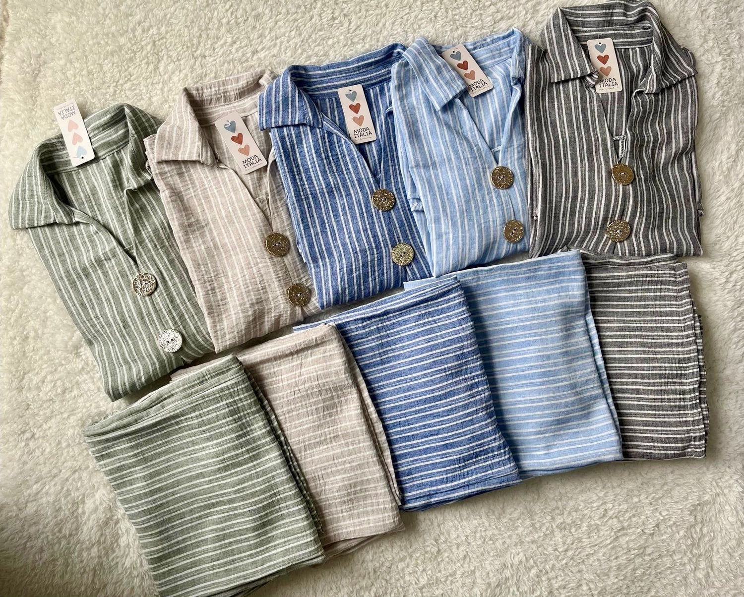 Woman wearing sage green linen co ord set with longline shirt and wide-leg trousers