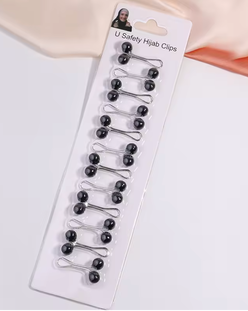 Hijab clip alternative to pins designed to prevent holes and snags.
