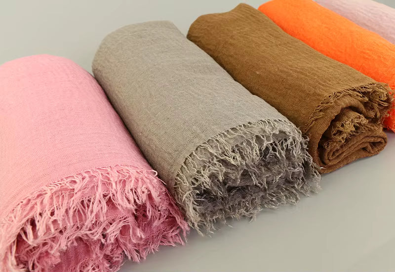 Textured crinkle cotton hijab with natural deep crinkles and soft frayed edges.