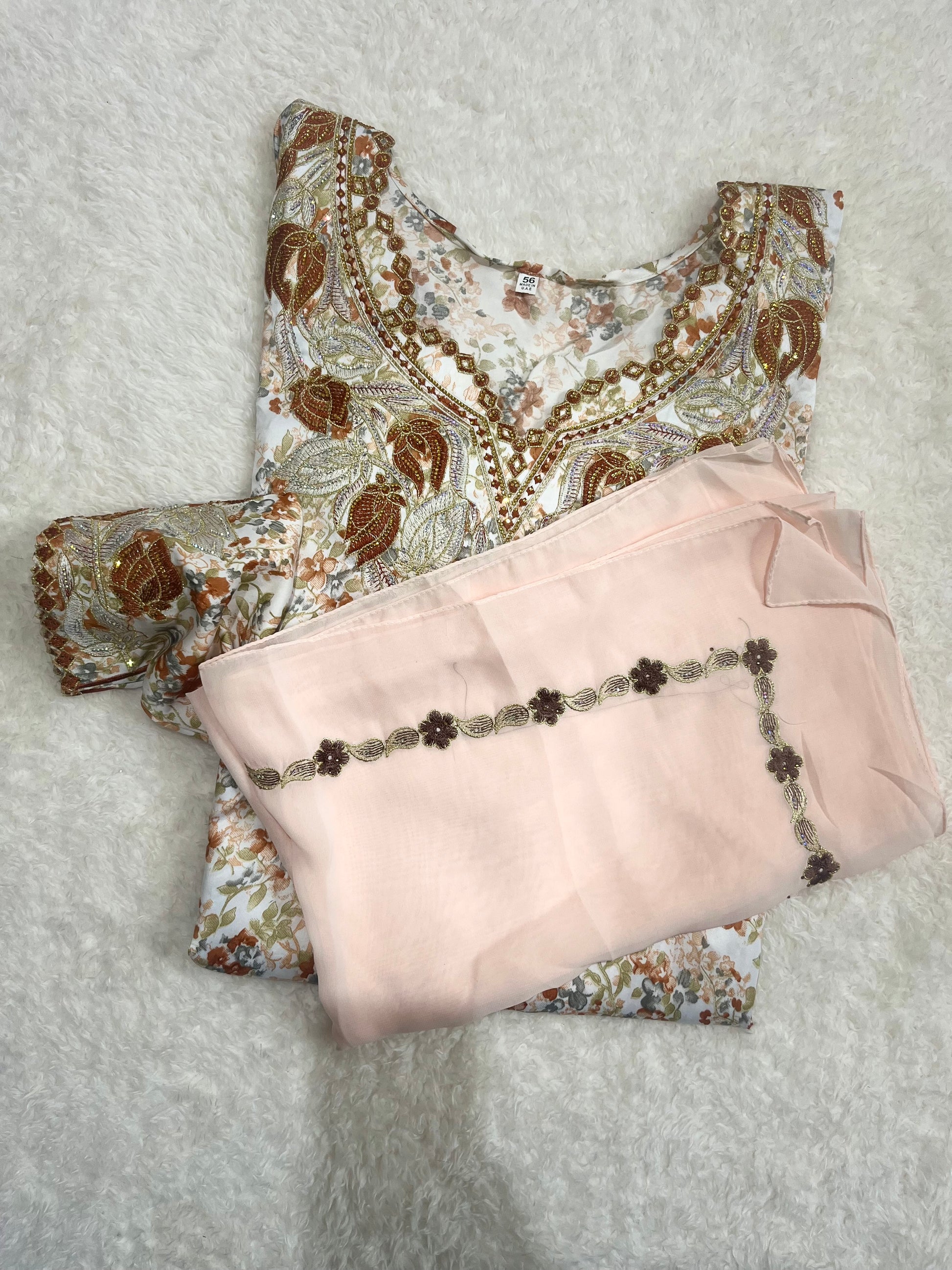 Luxury Desert Rose Mukhawar with intricate embroidery and flowing silhouette