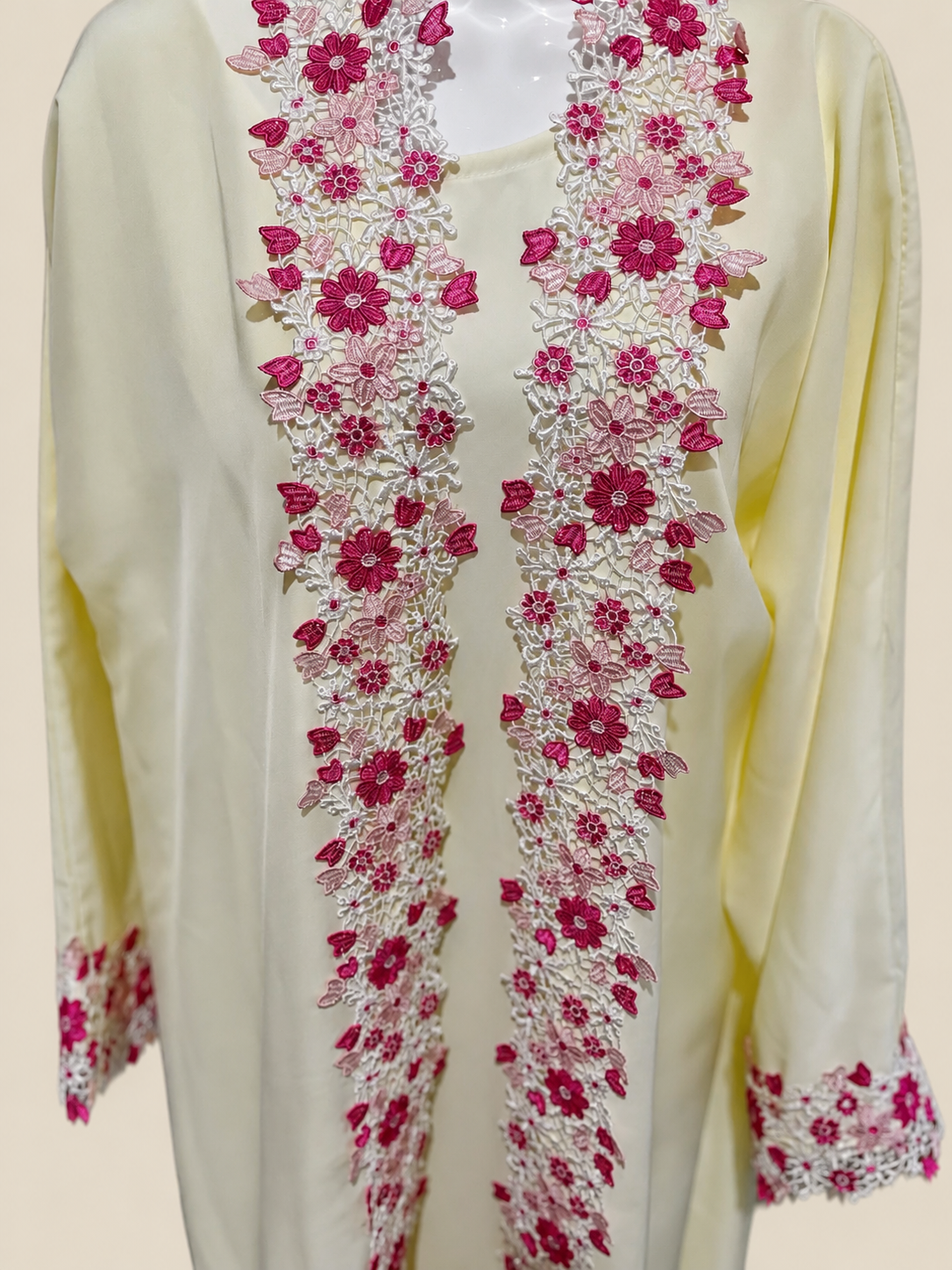 Close-up of the ZAHRA Butter Yellow Floral Lace Open Abaya featuring intricate pink floral lace embroidery on premium Nida fabric