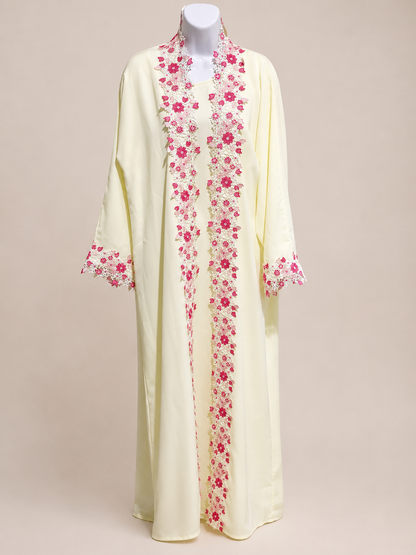 ZAHRA Butter Yellow Floral Lace Open Abaya displayed on a mannequin, showcasing the elegant floral lace trim and flowing Nida fabric